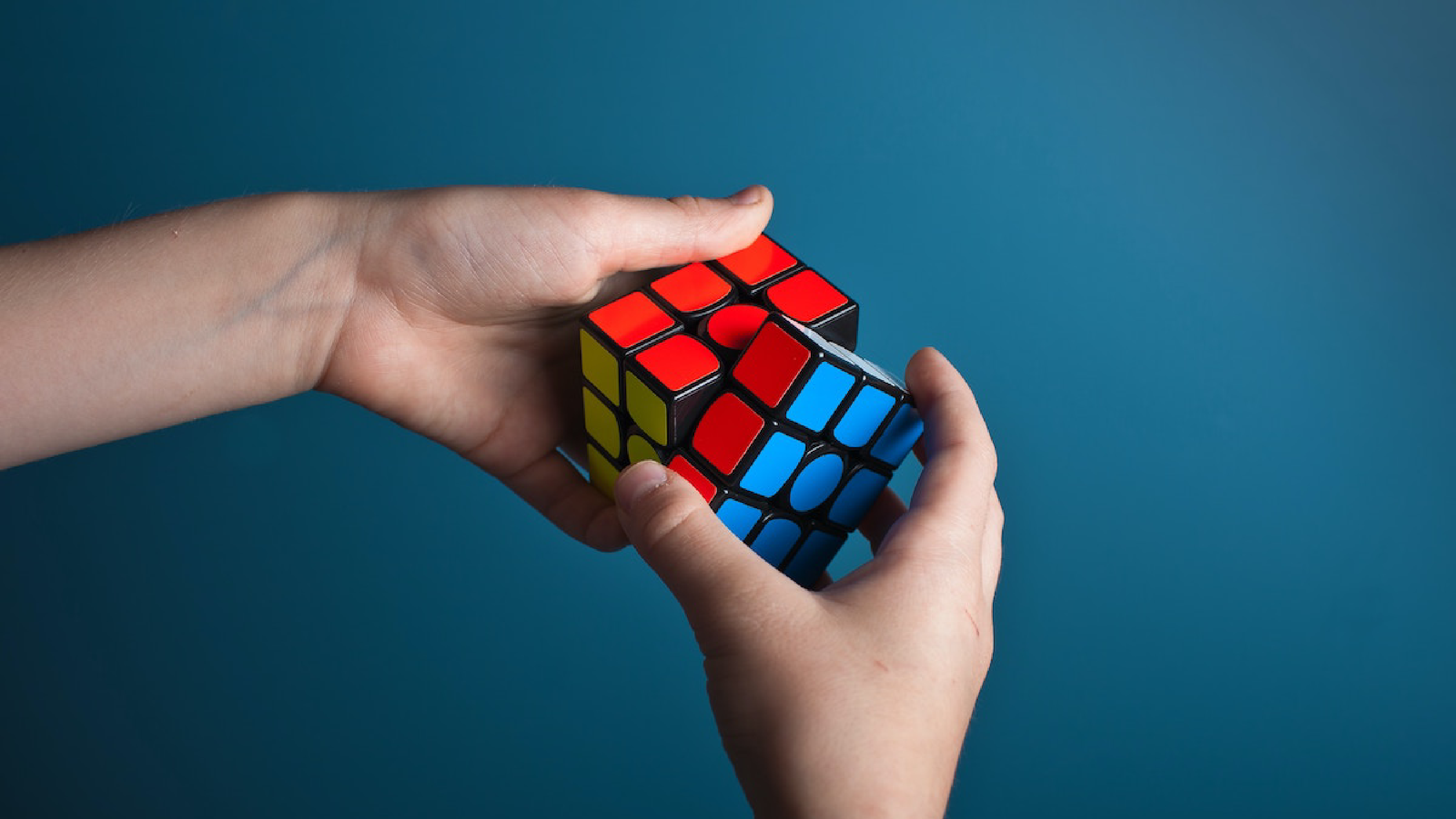 Person solving rubics cube