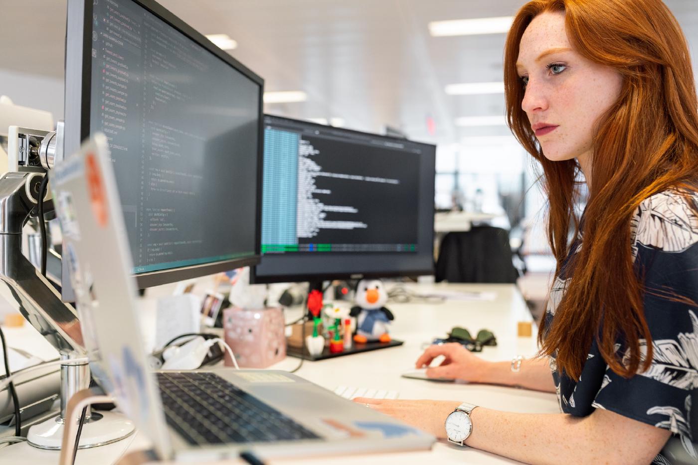 Female office worker looking at computer screen